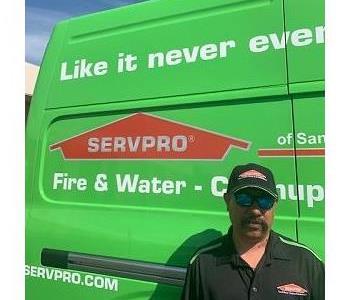 Male employee in front of van