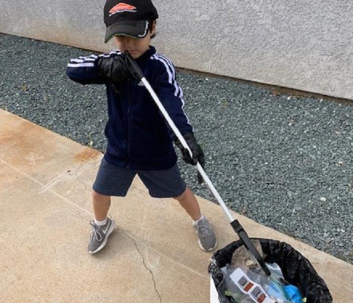 Six Year Old helping with trash pickup