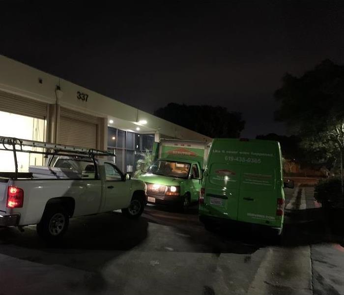 SERVPRO Van and Truck at night 