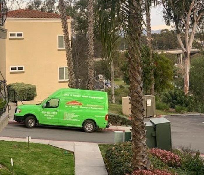SERVPRO van parked and palm trees 